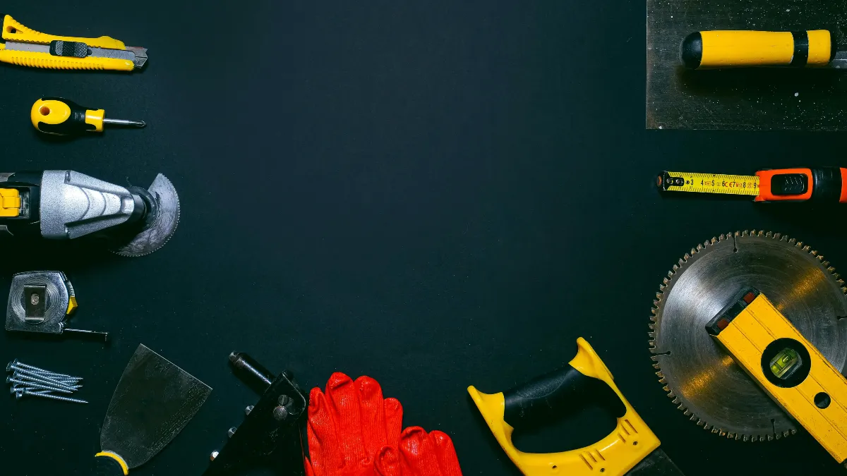 Incoming business call on a mobile phone next to trade tools showing the importance of answering quickly