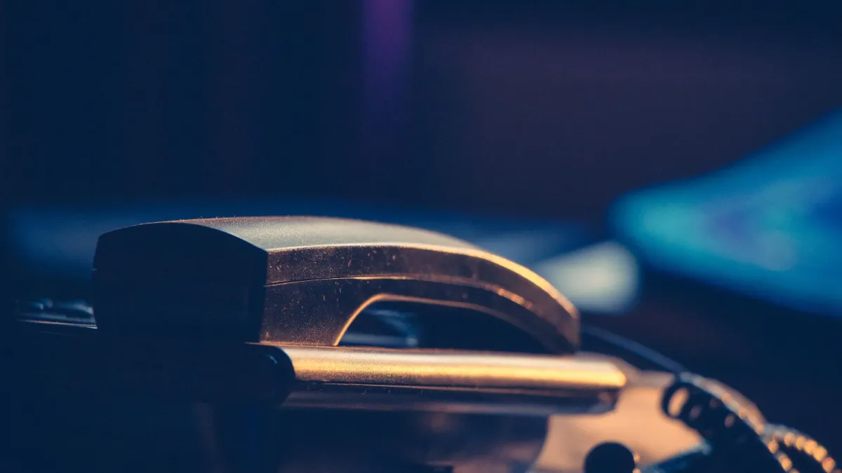 A phone ringing in an empty office after closing time