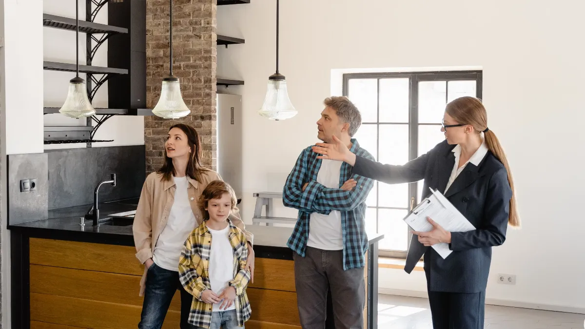 Agent showing a house to applicants at a viewing
